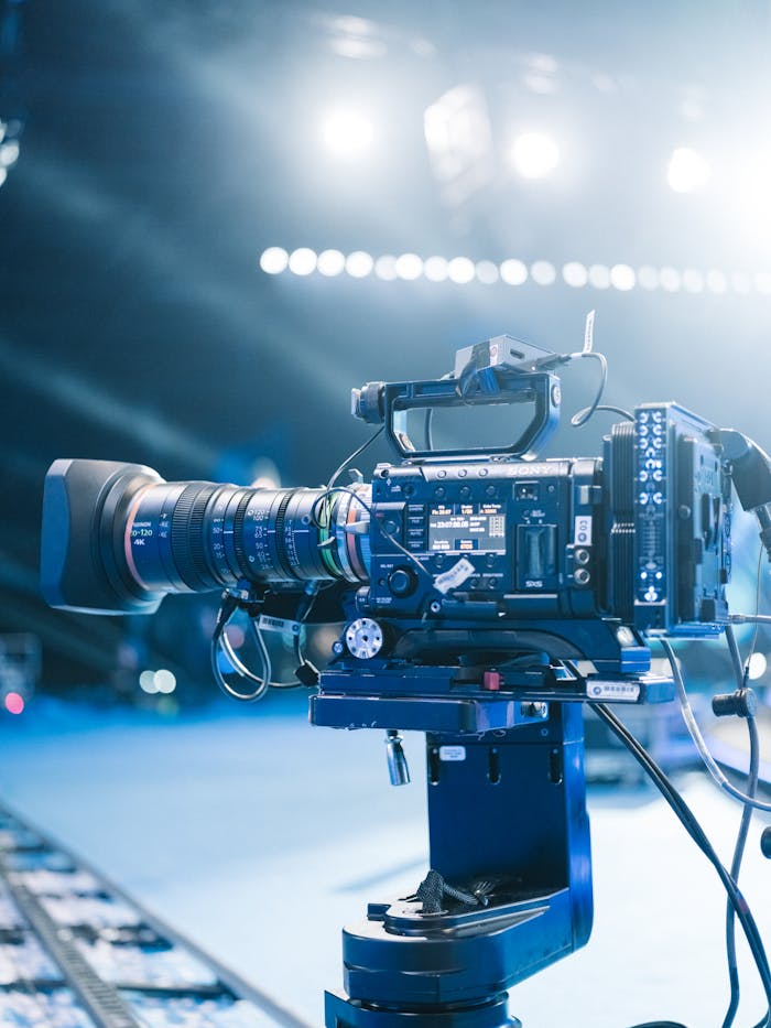 Home High-end professional video camera setup for filming on set with bright stage lights.